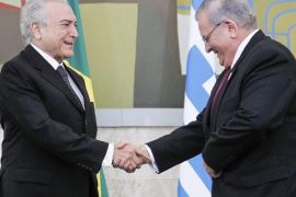 A handout photo made available by the Presidency of Brazil on 30 December 2016 shows Brazilian President Michel Temer (L) shaking hands with Greece's ambassador to Brazil Kyriakos Amiridis (R), during a ceremony in Brasilia, Brazil, 25 May 2016. Amiridis was last seen on Monday, 26 December in the Nova Iguacu neighborhood while en route to Rio de Janiero, and was reported missing by his wife on 28 December 2016, according to the Rio State Police. On 29 December, a burn