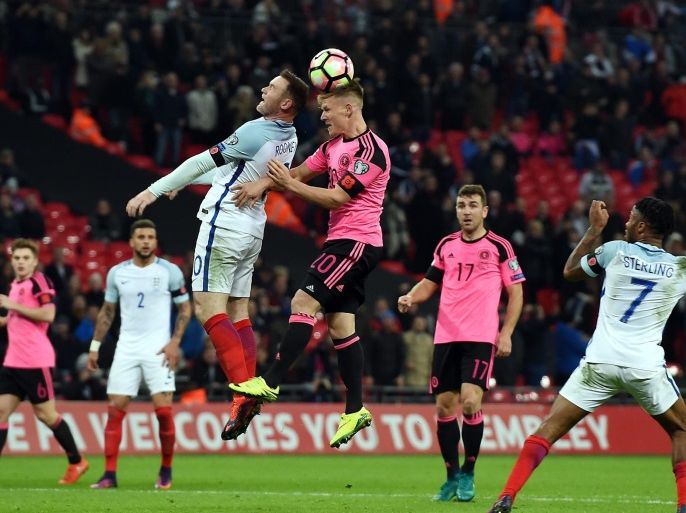 England's Wayne Rooney (L) in action against Scotland's Matt Ritchie (C) during the FIFA World Cup 2018 Qualification group F match between England and Scotland at Wembley Stadium in London, Britain, 11 November 2016.