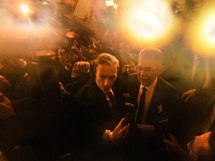 Austrian presidential candidate and former head of the Austrian Green Party, Alexander Van der Bellen (C) arrives to Hofburg palace after polls closed in the re-run of the Austrian presidential elections run-off in Vienna, Austria, 04 December 2016. Hofer on 04 December 2016 admitted his defeat to Van der Bellen in the re-run of the presidential elections run-off. Austrians went to the polls for a re-run of the 22 May run-off which was narrowly won by van der Bellen but