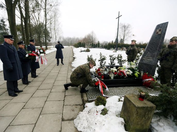 The delegation of First Transport Air Force Base with family and friends of Major Arkadiusz Protasiuk, the pilot of presidential plane TU-154M who died in Smolensk crash, lay wreaths at his grave in Grodzisk Mazowiecki, Poland, 10 April 2013. Poland remembers the the third anniversary of Smolensk crash, in which then Poland's President Lech Kaczynski, his wife Maria Kaczynska and 94 others died on 10 April 2010 when Polish presidential plane crashed in Smolensk, Russia