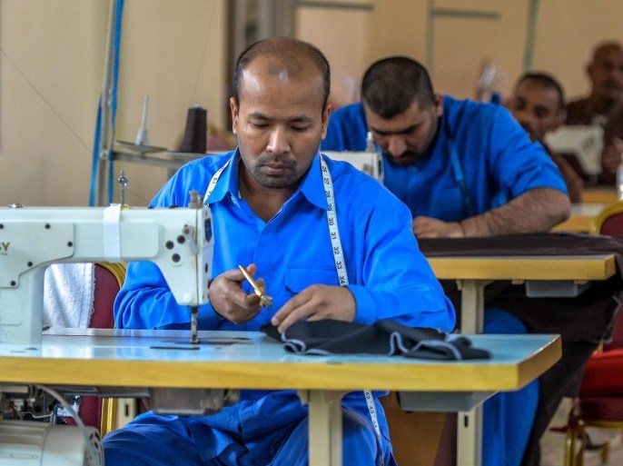 A picture made available on 22 November 2016 shows prisoners working in a tailoring workshop at the central prison compound of Kuwait, 20km west of Kuwait City, Sulaibya area, Kuwait, 21 November 2016. Prisoners spend their time in learning tailoring and other useful professions as part of a rehabilitation program in prisons of Kuwait. The prison administration in Kuwait encourage prisoners to learn professions and complete their studies if they need. The prison compoun