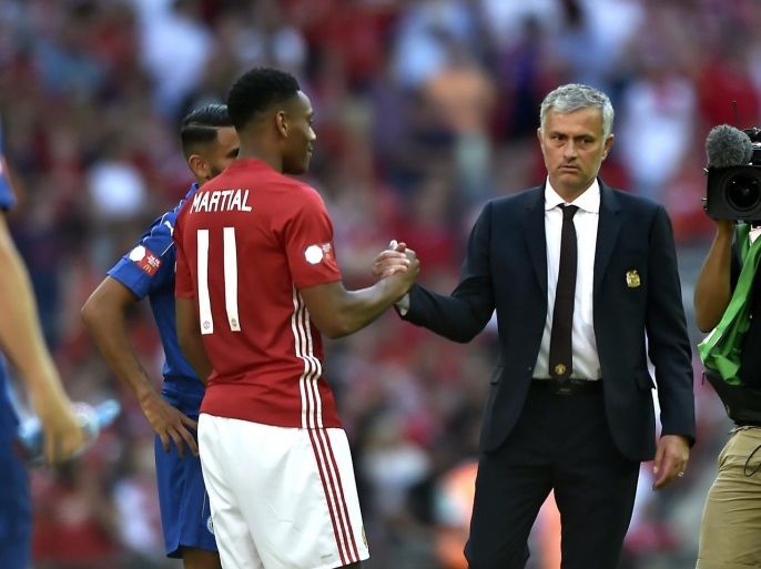 Manchester United's manager Jose Mourinho (C) shakes hands with Manchester United's Anthony Martial (L) after winning against Leicester City to win the FA Community Shield at Wembley stadium in London, Britain, 07 August 2016.
