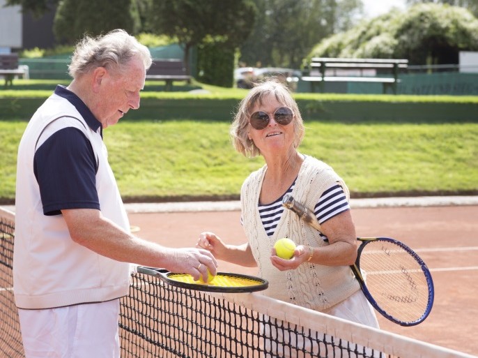 DORTMUND, GERMANY - AUGUST 11: Older couple playing tennis to stay active and healthy on August 11, 2014, in Dortmund, Germany. Physical activity can have a number of benefits for health, especially for the elderly. Photo by Ute Grabowsky/Photothek via Getty Images)***Local Caption***