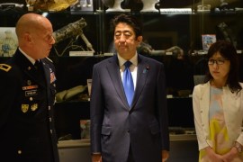 A handout photo made available by the US Department of Defense on 27 December 2016 shows US Army Brig. Gen. Mark Spindler (L) briefing Japanese Prime Minister Shinzo Abe (C) and Japanese Defense Minister Tomomi Inada (R) on the agency's recovery operations at the Defense POW/MIA Accounting Agency (DPPA) facility as part of his Hawaii visit to recognize the Japanese attacks on Pearl Harbor, Joint Base Pearl Harbor-Hickam, Oahu, Hawaii, USA, 26 December 2016. Abe is the first Japanese leader to publicly view the site of the Pearl Harbor Attack since 1951. EPA/KATHERINE DODD / US DEPARTMENT OF DEFENSE HANDOUT