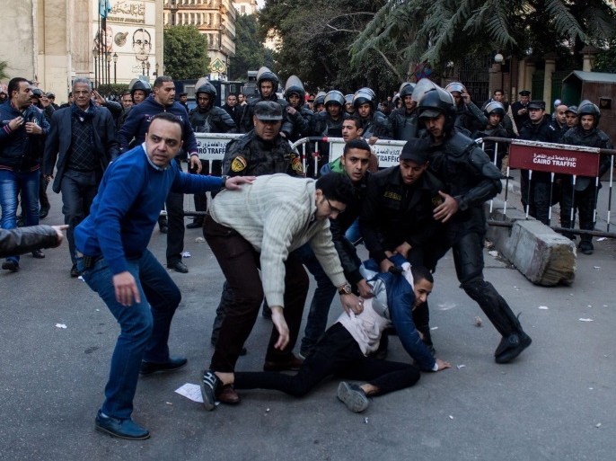 Egyptian policemen, including plain-clothed officers, detain a protester during a demonstration against the Egypt-Saudi border demarcation agreement, in Cairo, Egypt, 02 January 2017. Reports state dozens gathered to protest after Egyptian government referred the Egyptian-Saudi demarcation agreement to parliament. The agreement, if approved, will put the Egyptian-controlled Red Sea islands of Tiran and Sanafir under Saudi sovereignty.