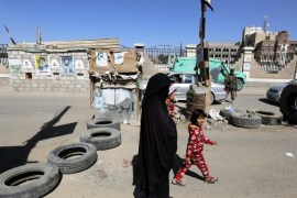 A Yemeni woman and her children pass a Houthi checkpoint amid heightened security in Sana'a, Yemen, 27 December 2016. According to reports, violent clashes are intensifying between the Houthi rebels and Yemen's Saudi-backed government forces at the Nihem region, east of the capital Sana'a after pro-government forces captured key positions in Yemen's south-central Shabwah province from the rebels and their allies.