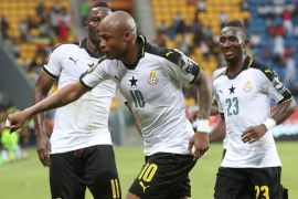 Andre Ayew of Ghana (c) celebrates a goal with teammates Wakaso Muburak (l) and Harrison Afful (r) during the 2017 Africa Cup of Nations match between Ghana and Uganda at the Port Gentil Stadium in Gabon on 17 January 2017.