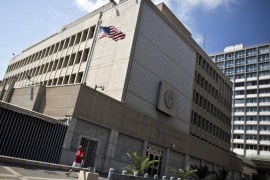 A pedestrian walks past the U.S. embassy in Tel Aviv August 5, 2013. The United States extended embassy closures by a week in the Middle East and Africa as a precaution on Sunday after an al Qaeda threat that U.S. lawmakers said was the most serious in years. The United States initially closed 21 U.S. diplomatic posts for the day on Sunday. Some of those reopened on Monday, including Kabul, Baghdad, Algiers and Israel. REUTERS/ Nir Elias (ISRAEL - Tags: POLITICS)