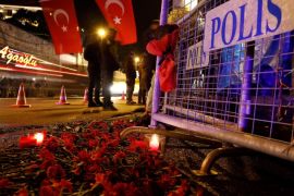 Flowers are placed in front of a police barrier near the entrance of Reina nightclub by the Bosphorus, which was attacked by a gunman, in Istanbul, Turkey, January 1, 2017. REUTERS/Umit Bektas
