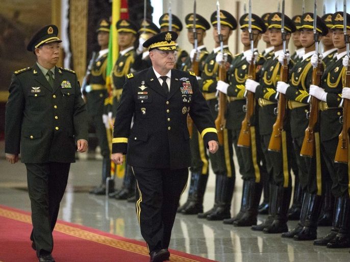 U.S. Army Chief of Staff General Mark Milley (C) is accompanied by China's People's Liberation Army (PLA) General Li Zuocheng (L) as they inspect a guard of honor during a welcome ceremony at the Bayi Building in Beijing, 16 August 2016. The 39th U.S. Army Chief of Staff is visiting the Asia-Pacific region, including China, South Korea, Japan and Hawaii from 15 to 23 August, according to an U.S. Army press release.