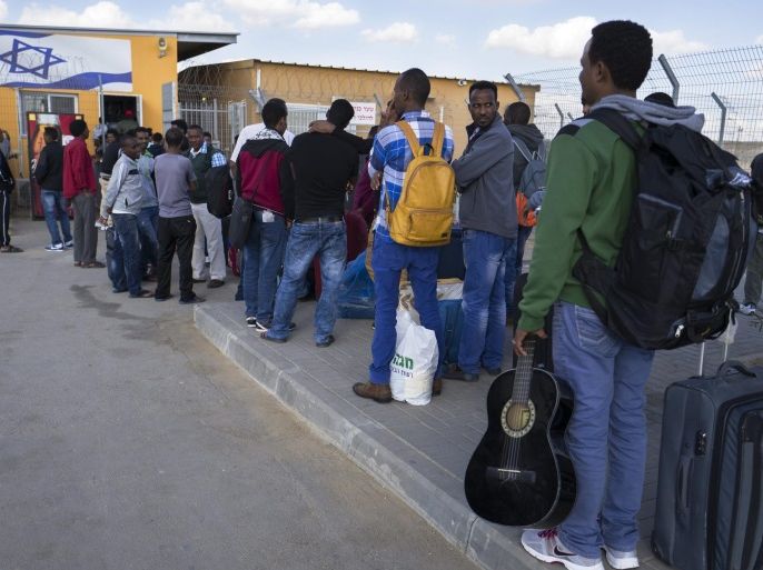 Newly arriving African migrant stand in line at the entrance to the Holot detention facility in the Negev Desert, in Israel, along the Egyptian border, 02 December 2015. Israel media reports that the center is the fullest it has ever been, housing some 2,500 asylum seekers mainly from Eritrea and Sudan. Hundreds more are expected to be sent there by Israeli authorities in the coming weeks. The detention center allows prisoners to be outside, but they must report back s