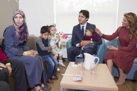 Canada's Prime Minister Justin Trudeau and his wife Sophie Gregoire Trudeau greet Syrian refugees Ahmad Al Krad (L), his wife Doaa Al Mahmed (2nd L) and his children Nasser, Panem and Muneer Ahmad at the Immigration Services Society in Vancouver, B.C., Canada, September 25, 2016. REUTERS/Jonathan Hayward/Pool