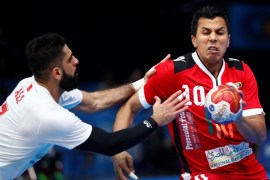 Men's Handball - Bahrain v Egypt - 2017 Men's World Championship Main Round - Group D - Accor HotelsArena in Bercy, Paris, France - 16/01/17 - Eslam Issa of Egypt and Ali Merza Salman of Bahrain in action. REUTERS/Gonzalo Fuentes