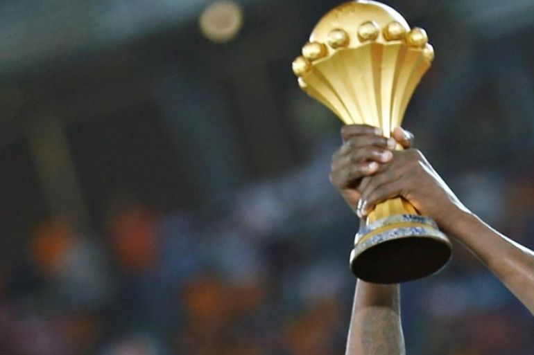 FILE PHOTO: Ivory Coast's captain Yaya Toure raises the trophy after winning the African Nations Cup final soccer match against Ghana in Bata, February 8, 2015. REUTERS/Amr Abdallah Dalsh/File Photo