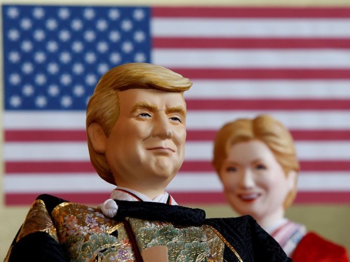 Japanese doll-maker Kyugetsu Inc's dolls depicting U.S. President Donald Trump (L) and former Democratic presidential nominee Hillary Clinton, as part of a traditional set of Japanese ornamental hina dolls used in Japan to celebrate Girls' Day, are pictured at the company's main shop in Tokyo, Japan, January 26, 2017. REUTERS/Toru Hanai FOR EDITORIAL USE ONLY. NO RESALES. NO ARCHIVES.