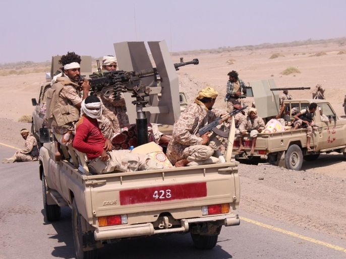 Members of the Yemeni army ride on the back of military trucks near the Red Sea coast city of al-Mokha, Yemen January 23, 2017. REUTERS/Fawaz Salman