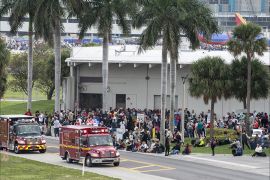 epaselect epa05702342 Firemen and ambulances wait outside the Fort Lauderdale's airport in Florida, USA, on 06 January 2017, after a gunman opened fire killing five people and injuring eight more. According to media reports a suspect is in custody. EPA/GIORGIO VIERA