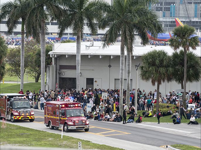 epaselect epa05702342 Firemen and ambulances wait outside the Fort Lauderdale's airport in Florida, USA, on 06 January 2017, after a gunman opened fire killing five people and injuring eight more. According to media reports a suspect is in custody. EPA/GIORGIO VIERA
