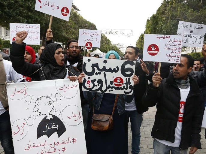 Tunisian Unemployed hold placards demanding jobs and shout slogans during the celebration to mark the sixth anniversary of the uprising that ousted president Zine El Abidine Ben Ali, at the Avenue Habib Bourguiba in Tunis, Tunisia, 14 January 2017. Ben Ali and his wife went into exile in Saudi Arabia on 14 January 2011.