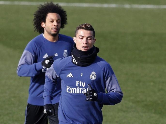 Real Madrid's Portuguese forward Cristiano Ronaldo (R) and Brazilian defender Marcelo (L) attend the team's training session at Valdebebas sport city in Madrid, Spain, 03 January 2016. Real Madrid will face Sevilla FC on 04 January in a King's Cup round of 16 match.
