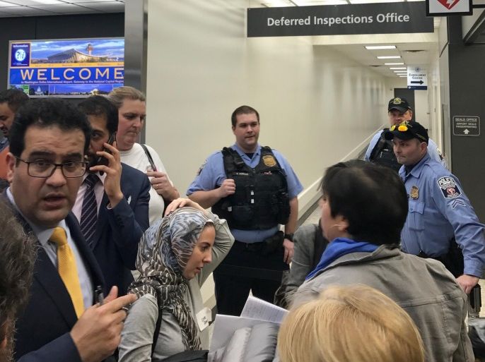 Lawyers gather to discuss how to gain access to a detainee held under a travel ban imposed by U.S. President Donald Trump's executive order, at Washington Dulles International Airport in Dulles, Virginia, U.S. January 28, 2017. REUTERS/Yeganeh Torbati