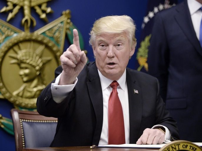 US President Donald Trump gestures during the signing of Executive Orders in the Hall of Heroes at the Pentagon in Arlington, Virginia, USA, 27 January 2017.