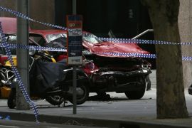 The wreckage of a car is seen as police cordoned off Bourke Street mall, after a car hit pedestrians in central Melbourne, Australia, January 20, 2017. REUTERS/Edgar Su