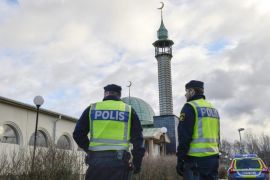 Two policemen stand outside a mosque in Uppsala, Sweden, 02 January 2015. Police have tightened security around some of Sweden's main mosques, after the mosque suffered a firebomb attack a day earlier, one of three arson attacks targeting the muslim community in Sweden since Christmas Day. EPA/ANDERS WIKLUND SWEDEN OUT
