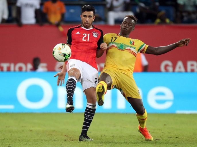 Mahmoud Hassan of Egypt (l) battles for the ball with Mamoutou N' Diaye (r) of Mali during the 2017 Africa Cup of Nations match between Mali and Egypt at the Port Gentil Stadium in Gabon on 17 January 2017.