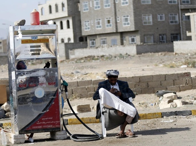 A black market petrol vendor waits for customers on a street during an ongoing fuel crisis that has been continuing for several months now, in Yemen's capital Sanaa November 4, 2015. REUTERS/Khaled Abdullah