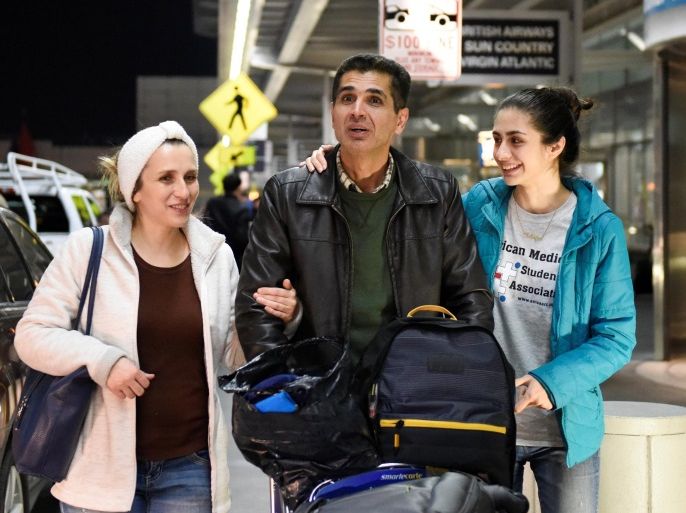 Medhi Radgoudarzi leaving the airport with his wife and daughter after being detained for five hours due to new immigration laws at San Francisco International Airport in San Francisco, California, U.S., January 28, 2017. REUTERS/Kate Munsch