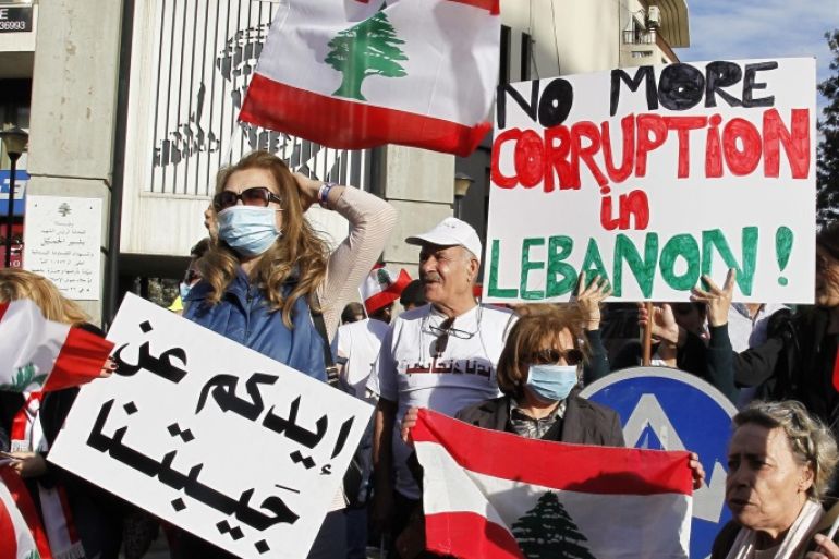 Lebanese activists from the 'We want accountability' movement and from civil democratic movements carry placards and wave their national flags during a demonstration that marched from Achrafieh to the Ryad Solh square in front the Government palace, downtown Beirut, Lebanon, 12 March 2016. The demonstrators demanded solutions for the ongoing garbage crisis, and abolition of corruption and accounting the corrupt.