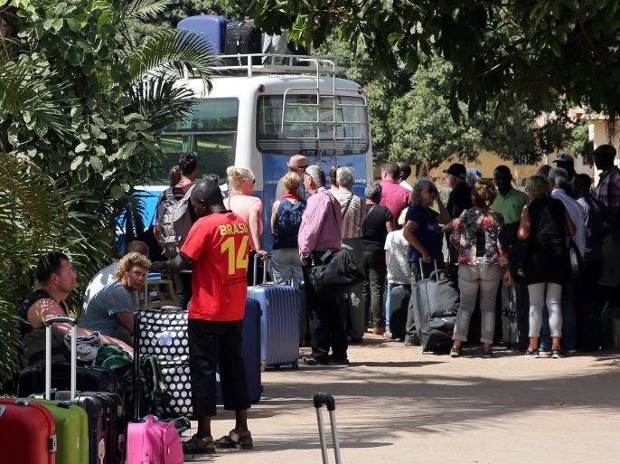 Tourists are seen gathered as they board tour buses leaving for the airport a day after the country declared a state of emergency, in Banjul, Gambia January 18, 2017. REUTERS/Afolabi Sotunde