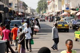 People walk on a street in Serekunda, Gambia December 3, 2016. REUTERS/ Thierry Gouegnon