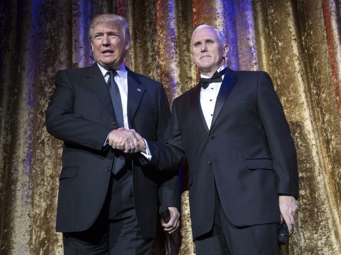 US President-Elect Donald Trump (L) welcomes Vice President-Elect Gov. Mike Pence to deliver remarks at the Chairman's Global Dinner, at the Andrew W. Mellon Auditorium in Washington, DC, USA, 17 January 2017. The invitation only black-tie event is a chance for Trump to introduce himself and members of his cabinet to foreign diplomats.