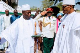 (FILE) - A file photograph dated 13 January 2017 shows President of Gambia Yahya Jammeh (L) welcoming President of Nigeria Muhammadu Buhari (R) for crisis talks at the State House in Banjul, Gambia. The parliament of Gambia on 18 January 2017 extended President Jammeh's term by 90 days. A state of emergency has been declared in the country with regional ECOWAS leaders threatening military action to oust President Jammeh following his refusal to accept election results and hand over power to President-elect Adama Barrow.