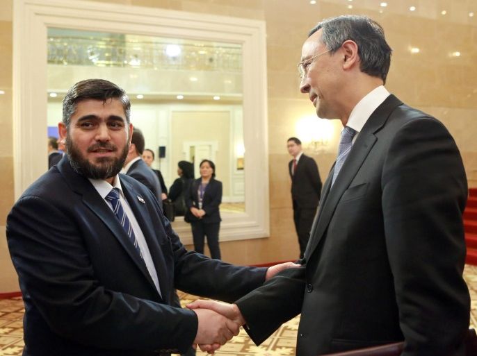 Mohammed Alloush (L), the Syrian leader of the opposition delegation shakes hands with Kazakh Foreign Minister Kairat Abdrakhmanov (R) during talks on the Syrian conflict, Astana, Kazakhstan, 23 January 2017. Representatives of Russia, Turkey and Iran are meeting in Astana from 23 to 24 January 2017 with the aim of strengthening a ceasefire that has largely held despite incidents of violence across Syria.