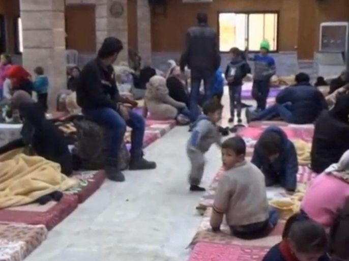 A still image taken from a video obtained by Reuters, said to be shot on January 4, 2017, shows civilians, who were evacuated from Wadi Barada, sitting inside a shelter in the Damascus suburb of Rawda, Syria. REUTERS TV/via REUTERS ATTENTION EDITORS - THIS IMAGE WAS PROVIDED BY A THIRD PARTY. EDITORIAL USE ONLY. NO RESALES. NO ARCHIVE.