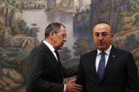 Russian Foreign Minister Sergei Lavrov (L) and his Turkish counterpart Mevlut Cavusoglu (R) attend a ceremony in memory of murdered Russian ambassador to Turkey Andrey (Andrei) Karlov before their talks in Moscow, Russia, 20 December 2016. Russia's ambassador to Turkey, Andrey Karlov, was shot at an art exhibition in the Turkish capital of Ankara on 19 December 2016. Turkish Foreign Minister arrived in Moscow to discuss Syria with Russian and Iranian counterparts.