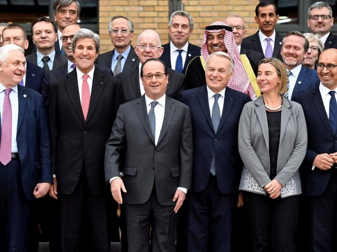 (First row From L) Russian Ambassador to France Alexander Orlov, US Secretary of State John Kerry, French President Francois Hollande, French Minister of Foreign Affairs Jean-Marc Ayrault, European Union Foreign Policy Chief Federica Mogherini, State Secretary for European Affairs Harlem Desir pose for a family picture during the Mideast peace conference in Paris, France, January 15, 2017. REUTERS/Bertrand Guay/POOL     TPX IMAGES OF THE DAY