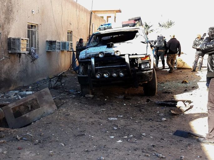 Iraqi policemen inspect the damage inside a police station in Samarra city, northern Iraq, 03 January 2017. At least 5 policemen were killed and ten others wounded when suicide bombers stormed a police station in Samarra, according to police reports.