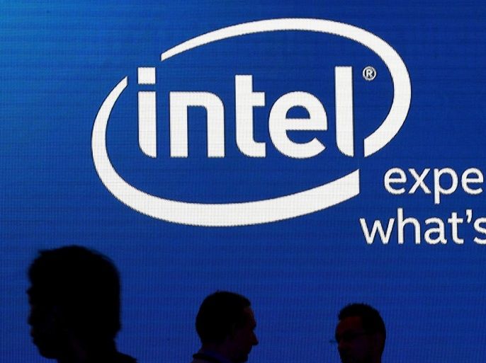 Shadows are cast near the Intel logo at the 2015 Computex exhibition in Taipei, Taiwan, June 3, 2015. Intel Corp said it would cut 12,000 jobs globally, or 11 percent of its workforce, as the company moves away from its traditional business of selling chips used in personal computers. REUTERS/Pichi Chuang/File photo