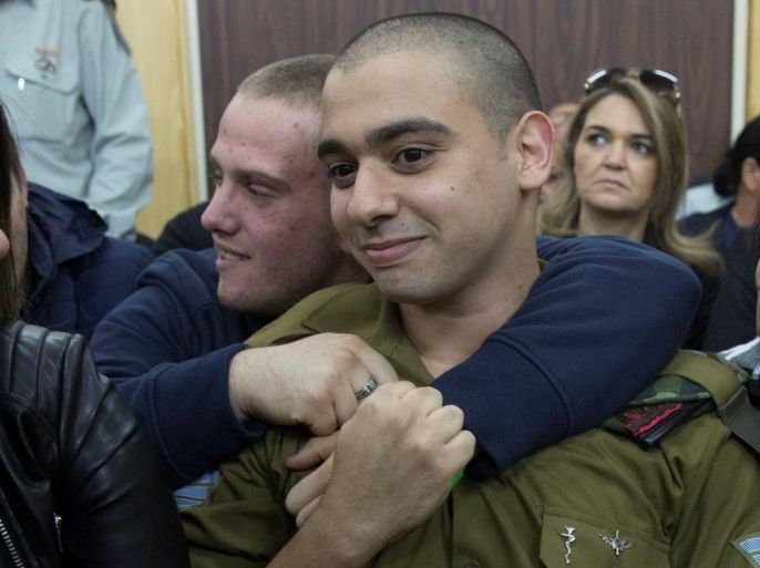 Israeli soldier Elor Azaria, who is charged with manslaughter by the Israeli military, sits to hear his verdict in a military court in Tel Aviv, Israel, January 4, 2017. REUTERS/Heidi Levine/Pool