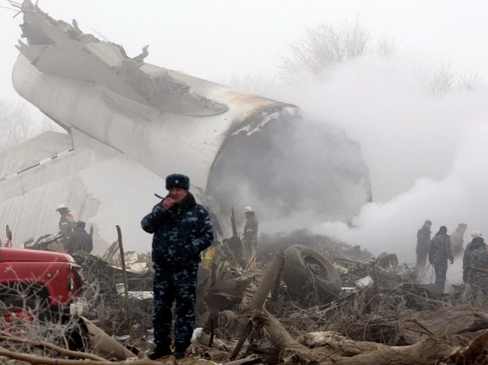 Rescuers work at the site of an airplane crash near the airport Manas, 30 km from Bishkek, Kyrgyzstan, 16 January 2017. A Turkish Boeing 747-400 cargo plane crashed on a village near the capital of Kyrgyzstan, destroying 32 houses and killing at least 37 people, according to reports. EPA/IGOR KOVALENKO