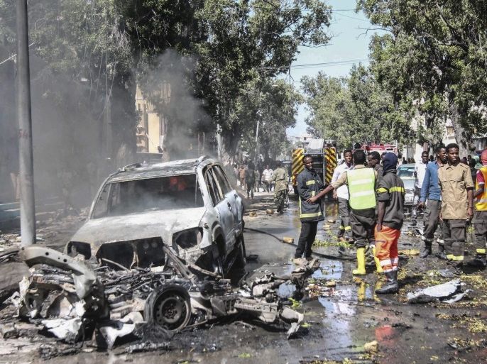 epaselect epa05565146 Firefighters gather at the scene of a suicide car bomb attack in Mogadishu, Somalia, 01 October 2016. Reports say that a suicide car bomb rammed into a popular restaurant near the presidential palace in the capital Mogadishu, killing at least two people. There is no claim of responsibility yet but the country's Islamist militant group al-Shabab often carries out similar attacks in Mogadishu.