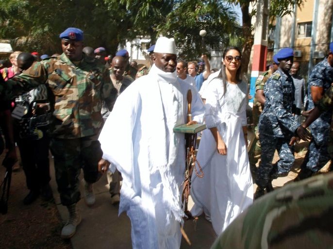 Gambian President Yahya Jammeh arrives at a polling station with his wife Zineb during the presidential election in Banjul, Gambia, December 1, 2016. REUTERS/Thierry Gouegnon