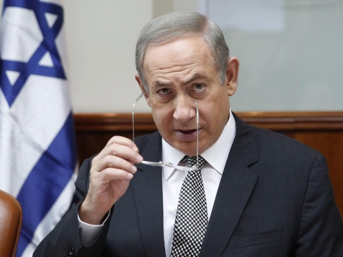 Israeli Prime Minister Benjamin Netanyahu attends the weekly cabinet meeting in Jerusalem, January 15, 2017. Netanyahu is under investigation on two separate charges of corruption and several hundred people have marched in Tel Aviv calling for him to resign.