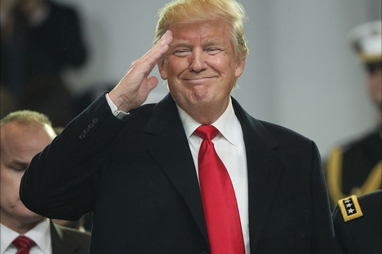 epa05736581 President Donald J. Trump salutes from the reviewing stand during the Inaugural Parade after he was sworn in as the 45th President of the United States in Washington, DC, USA, 20 January 2017. Trump won the 08 November 2016 election to become the next US President. EPA/JUSTIN LANE