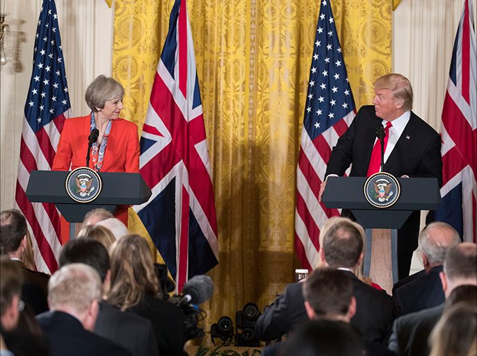 epa05755132 US President Donald J. Trump (R), with British Prime Minister Theresa May (L), delivers remarks during a joint press conference in the East Room of the White House in Washington, DC, USA, 27 January 2017. Prime Minister May is the first foreign head of state to meet with President Trump at the White House. EPA/SHAWN THEW