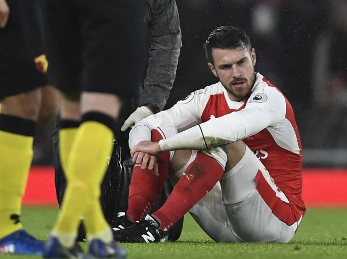 Britain Football Soccer - Arsenal v Watford - Premier League - Emirates Stadium - 31/1/17 Arsenal's Aaron Ramsey looks dejected after sustaining an injury Reuters / Dylan Martinez Livepic EDITORIAL USE ONLY. No use with unauthorized audio, video, data, fixture lists, club/league logos or "live" services. Online in-match use limited to 45 images, no video emulation. No use in betting, games or single club/league/player publications. Please contact your account representative for further details.